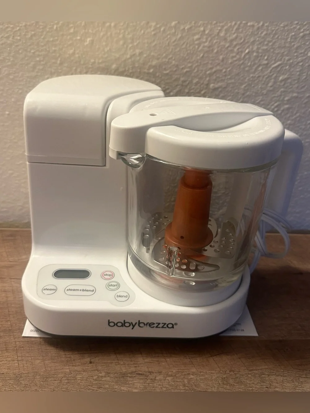 Baby Brezza Baby Food Maker in White with Orange Blade